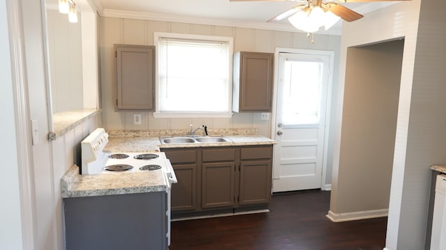 kitchen featuring plenty of natural light, light countertops, and a sink