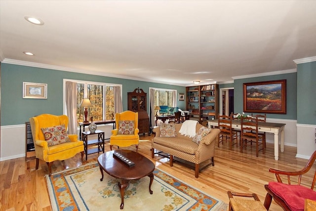 living room with crown molding, recessed lighting, baseboards, and wood finished floors