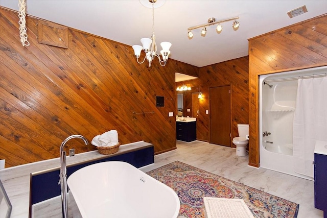 full bathroom with visible vents, wood walls, vanity, toilet, and a chandelier