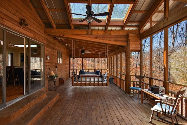 wooden deck featuring a ceiling fan