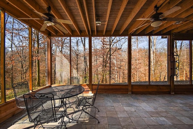 exterior space with outdoor dining space and ceiling fan