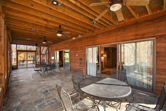 view of patio / terrace with outdoor dining area and a ceiling fan