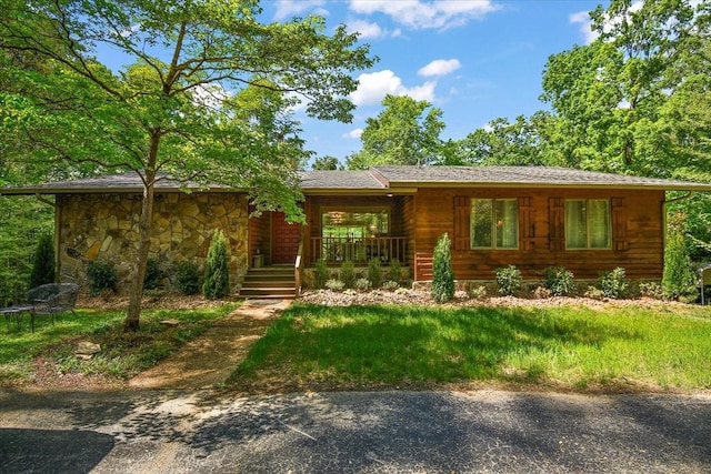 view of front of house featuring a porch and stone siding