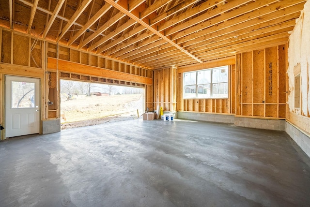 misc room featuring plenty of natural light and concrete flooring