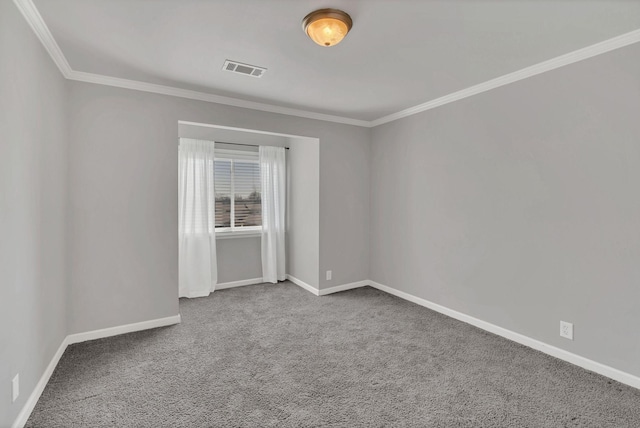 carpeted spare room featuring visible vents, crown molding, and baseboards