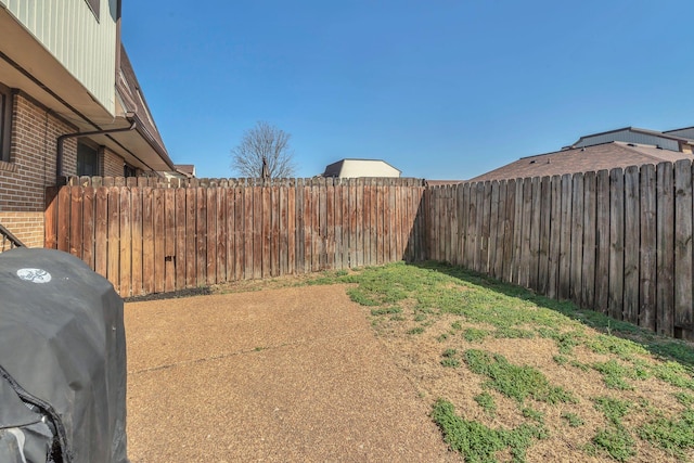 view of yard featuring a fenced backyard