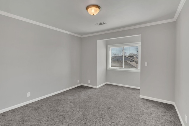 unfurnished room with visible vents, carpet floors, baseboards, and ornamental molding