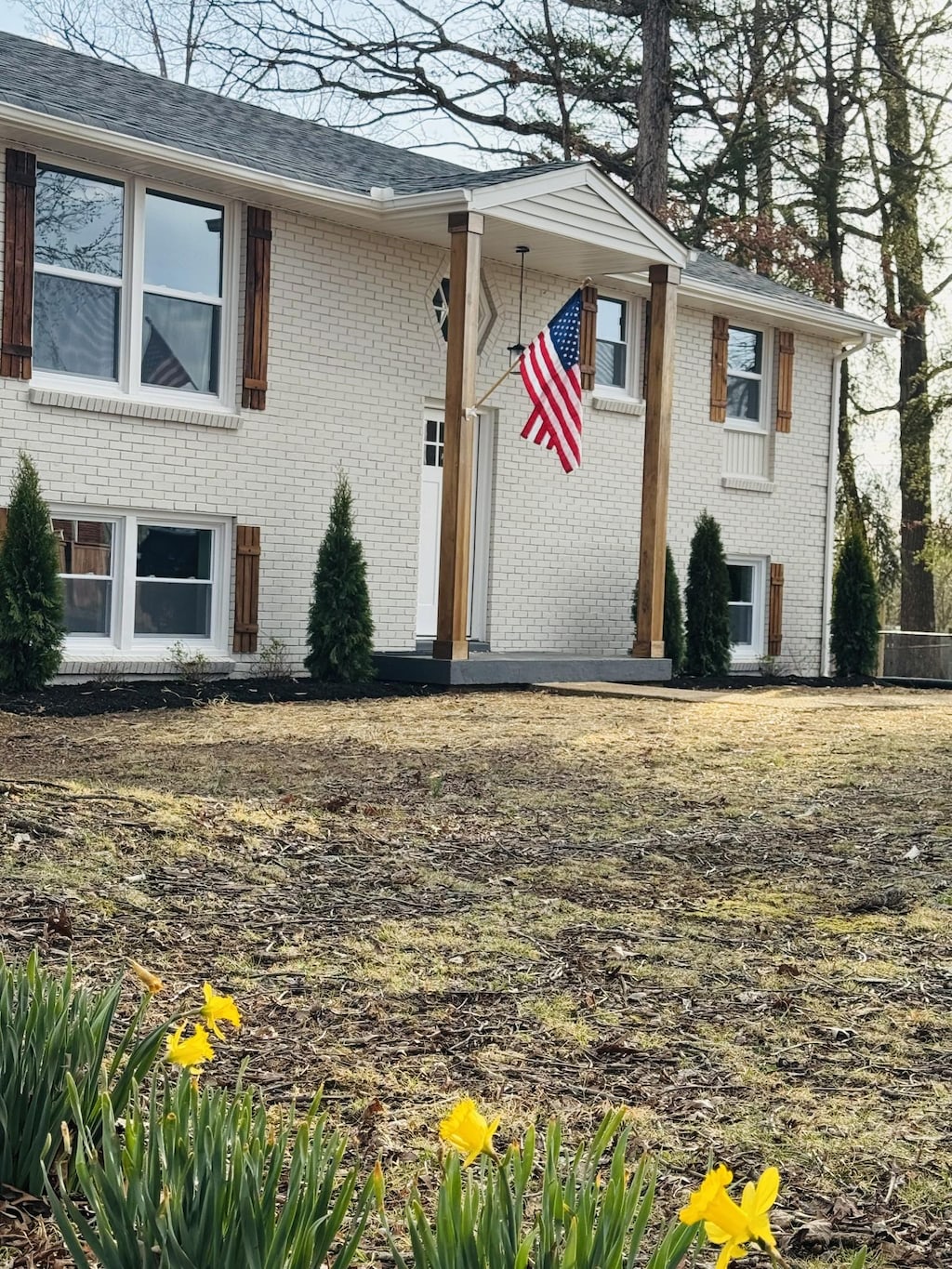 split foyer home with brick siding