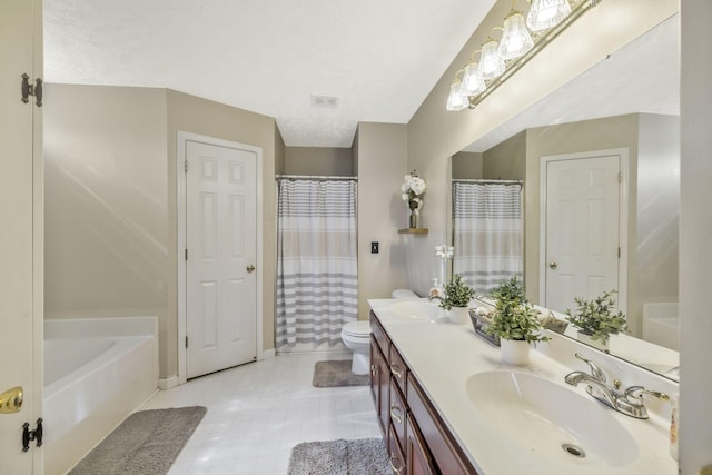 full bathroom featuring a sink, a bathing tub, toilet, and double vanity