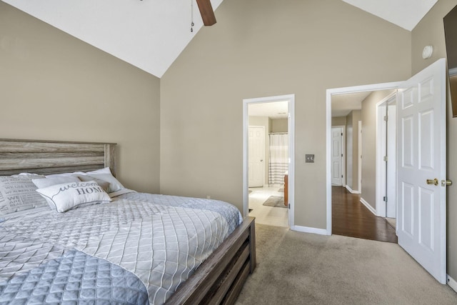 carpeted bedroom featuring ceiling fan, baseboards, and high vaulted ceiling