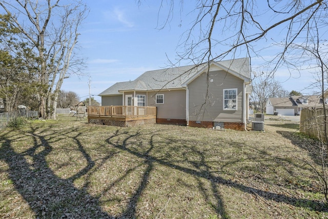 rear view of property with crawl space, central AC, a deck, and fence