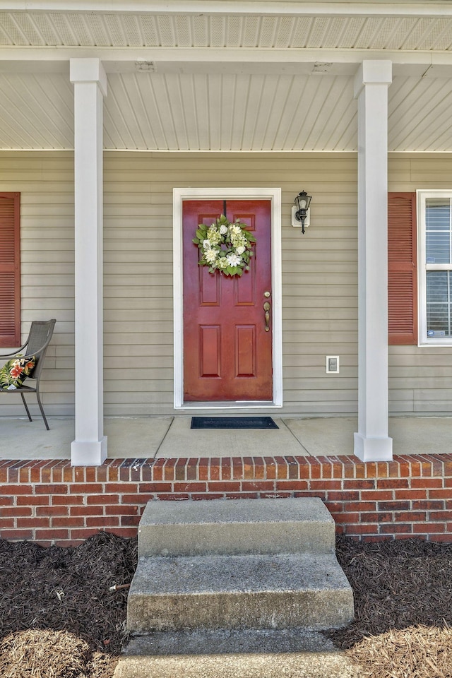 entrance to property with a porch