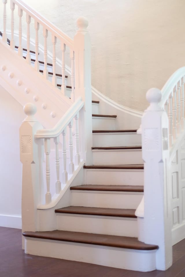 stairs featuring baseboards and wood finished floors