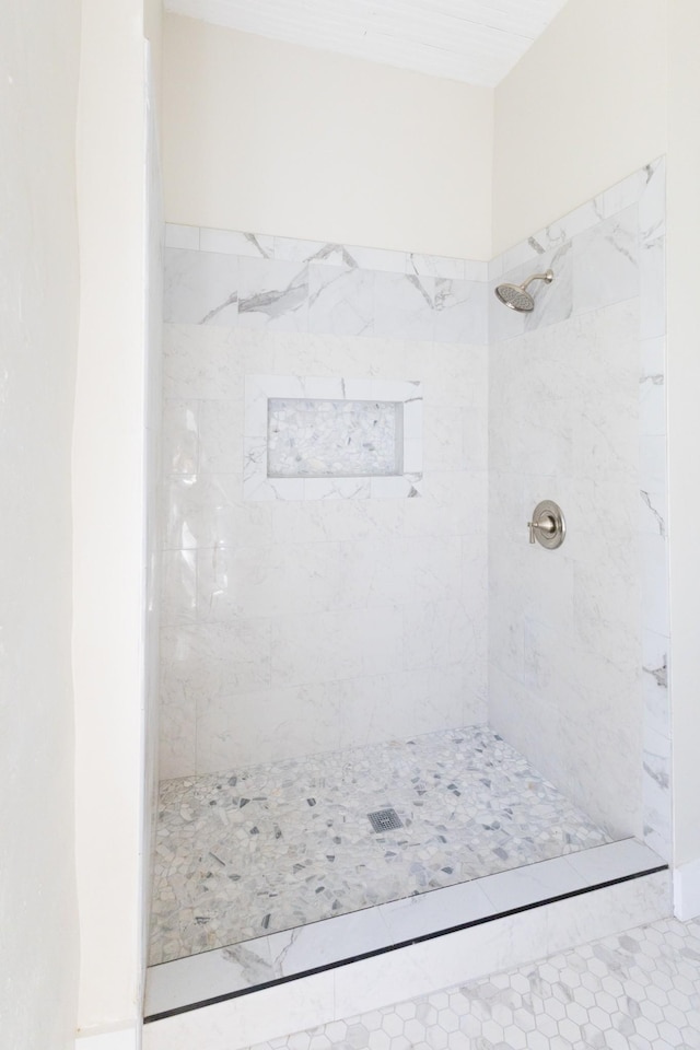 full bathroom with tiled shower