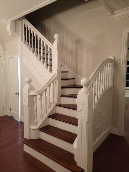 stairway featuring wood finished floors