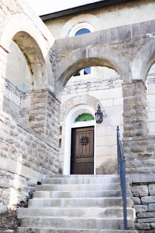 view of exterior entry with stone siding