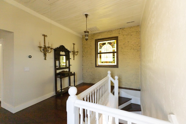 interior space with wooden ceiling, wood finished floors, and baseboards