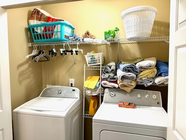 washroom with laundry area and washer and clothes dryer