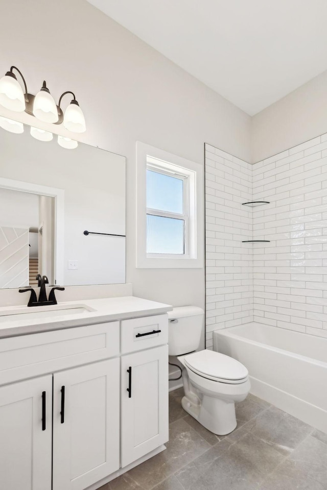 full bathroom featuring toilet, vanity, and bathtub / shower combination