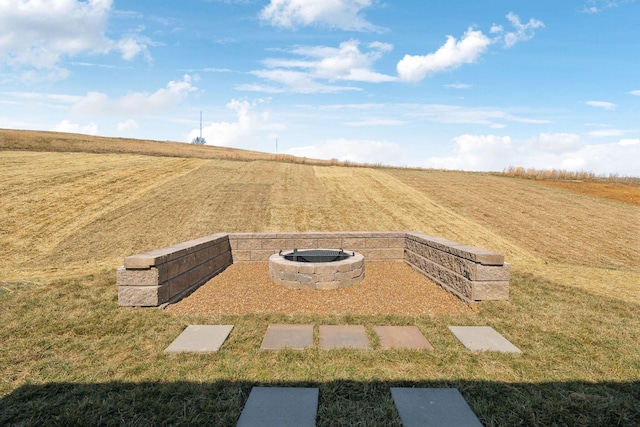 view of yard with a rural view and an outdoor fire pit