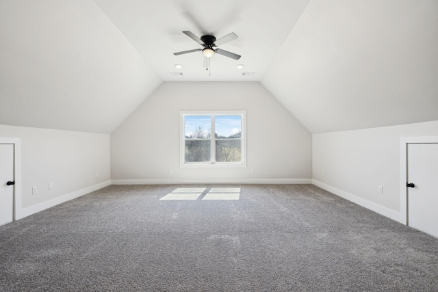 bonus room with baseboards, lofted ceiling, carpet floors, and a ceiling fan