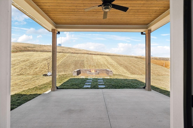 view of patio featuring ceiling fan