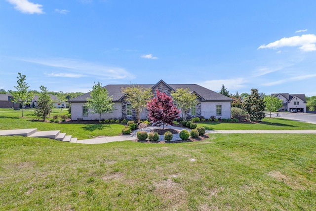 view of front of home with stone siding and a front lawn