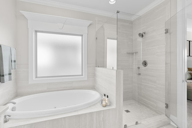 bathroom featuring crown molding, a bath, and a shower stall