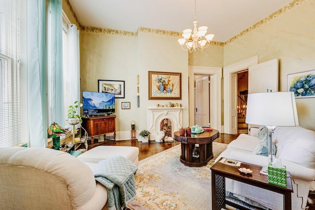 living room featuring a chandelier and wood finished floors