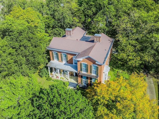 drone / aerial view featuring a view of trees