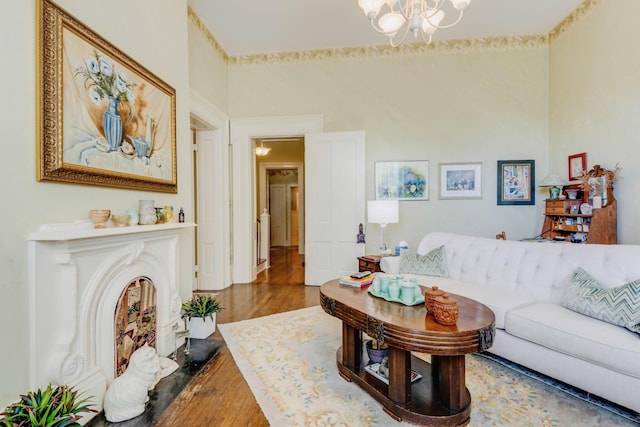 living room featuring an inviting chandelier and wood finished floors