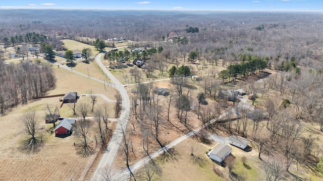 birds eye view of property featuring a rural view and a forest view