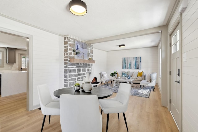 dining room with plenty of natural light and light wood-type flooring