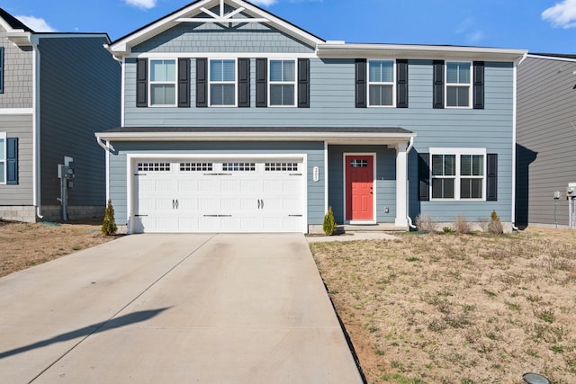 view of front of house featuring driveway and a garage