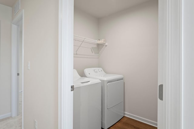 laundry room featuring laundry area, washer and dryer, baseboards, and visible vents