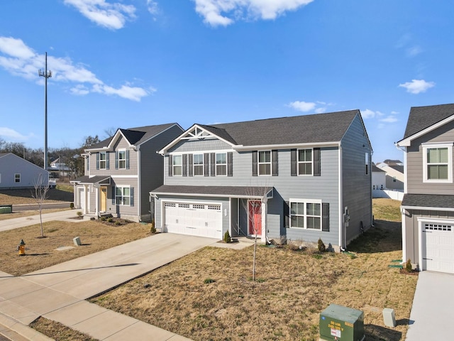 traditional-style house featuring a residential view, driveway, and an attached garage