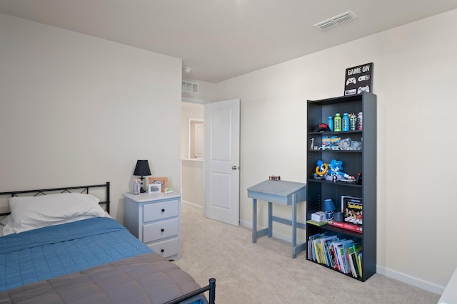 bedroom featuring visible vents, light colored carpet, and baseboards