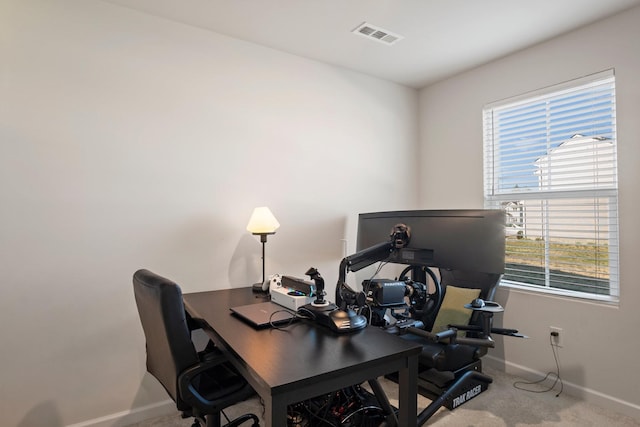 office with visible vents, baseboards, and carpet flooring