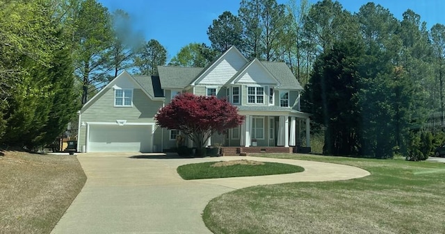 view of front of home featuring concrete driveway and a front yard