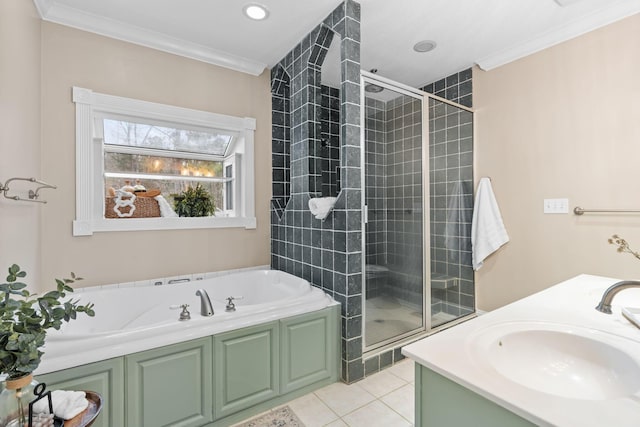 full bathroom with a garden tub, ornamental molding, a stall shower, tile patterned floors, and a sink