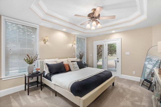 bedroom featuring access to exterior, crown molding, baseboards, light colored carpet, and a raised ceiling