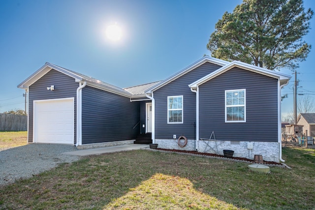 ranch-style home featuring a garage, a front lawn, entry steps, gravel driveway, and crawl space