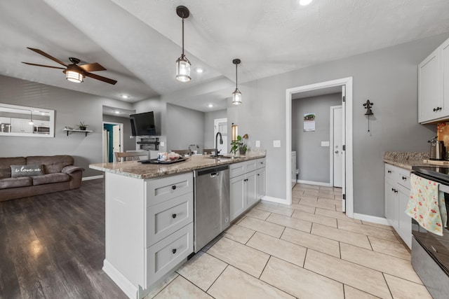 kitchen with range with electric cooktop, a ceiling fan, stainless steel dishwasher, open floor plan, and a peninsula