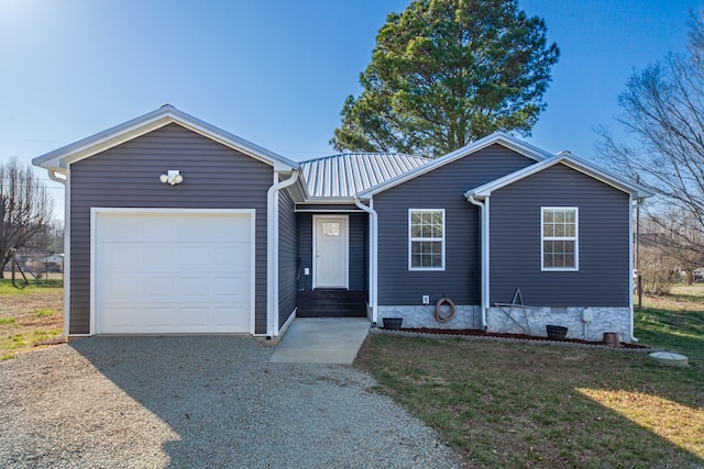 single story home featuring a front yard, driveway, a garage, crawl space, and metal roof