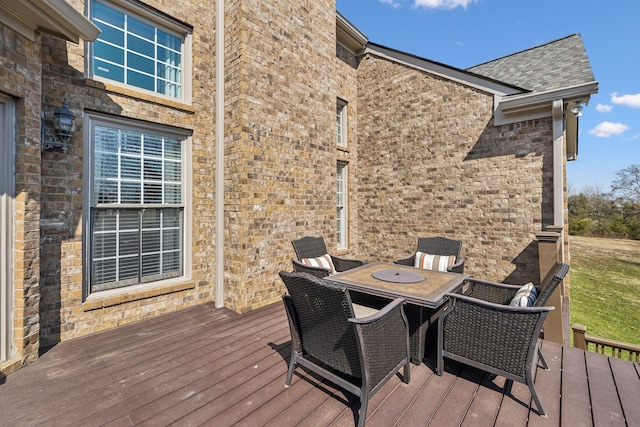 wooden terrace with outdoor dining area