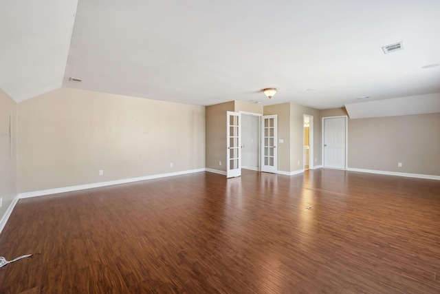 interior space featuring visible vents, baseboards, wood finished floors, and french doors