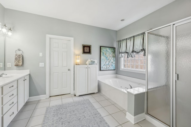 full bath with tile patterned floors, a garden tub, a stall shower, and vanity