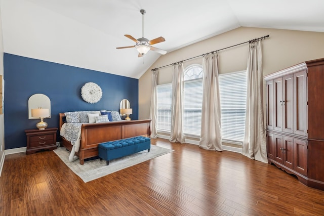 bedroom with vaulted ceiling, ceiling fan, and wood finished floors