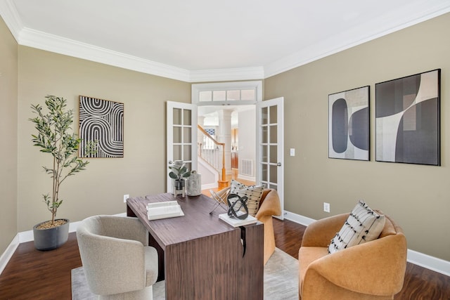 office area featuring baseboards, wood finished floors, crown molding, and ornate columns