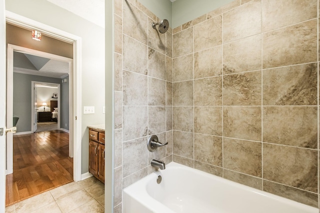 bathroom featuring bathtub / shower combination, tile patterned floors, and vanity